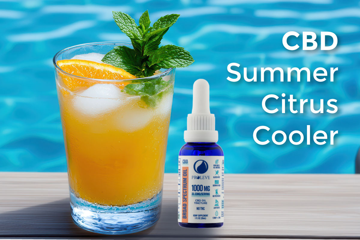 pool in background with orange mint drink and cbd bottle to right of the glass
