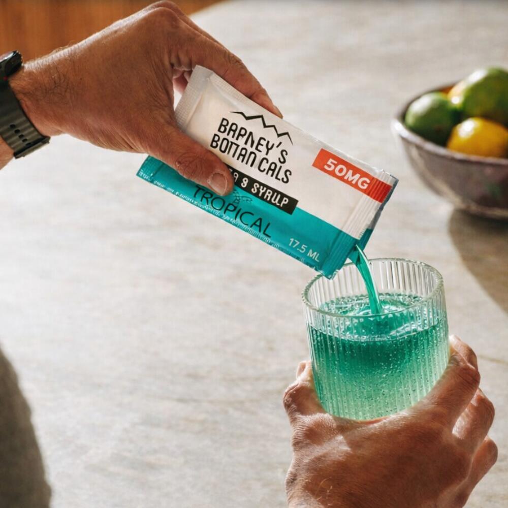 Barney's BotanicalsDelta 9 Syrup being used in a drinking glass